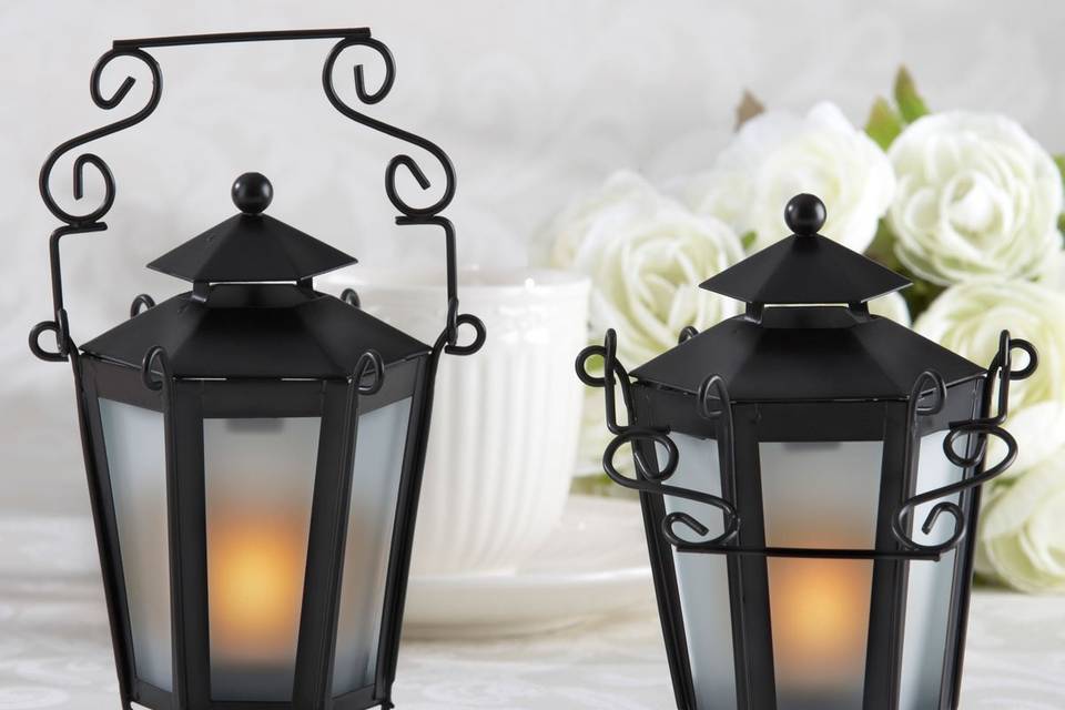 Give a little light to your guests with this awesome candle lantern party favor.  These metal lanterns hold a tealight making them not only an elegant party decoration but a great wedding favor.  And with Advantage Bridal's low price guarantee and fast shipping you'll fall in love with them, too!
