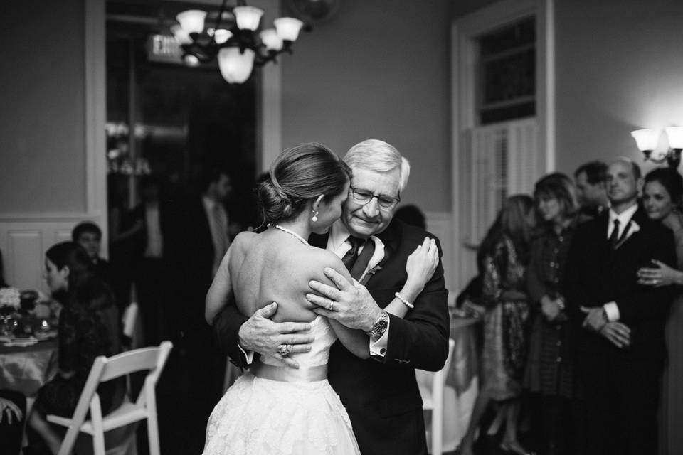 The bride and her father dancing