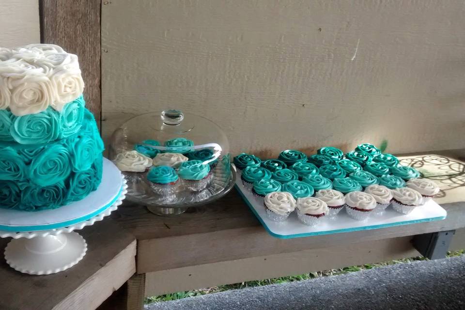 This Teal Ombre Two Tier Wedding Cake and Cupcakes were made out of Red Velvet Cake with Cream Cheese Frosting.  All from scratch!