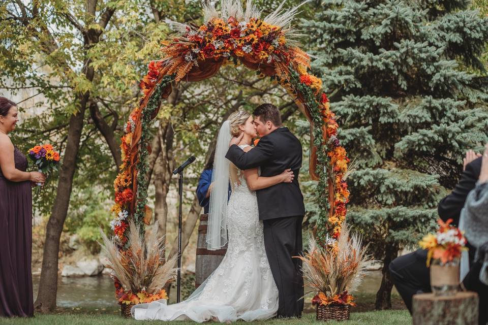 Ceremony with autumnal arch