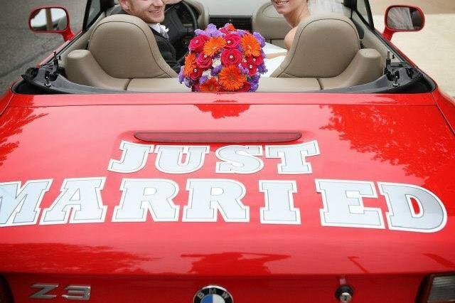 The couple on a red car