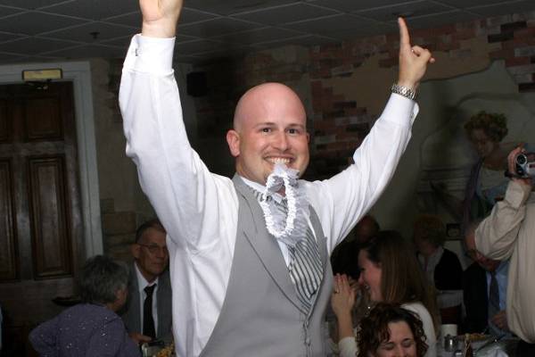 Groom with Garter in Mouth