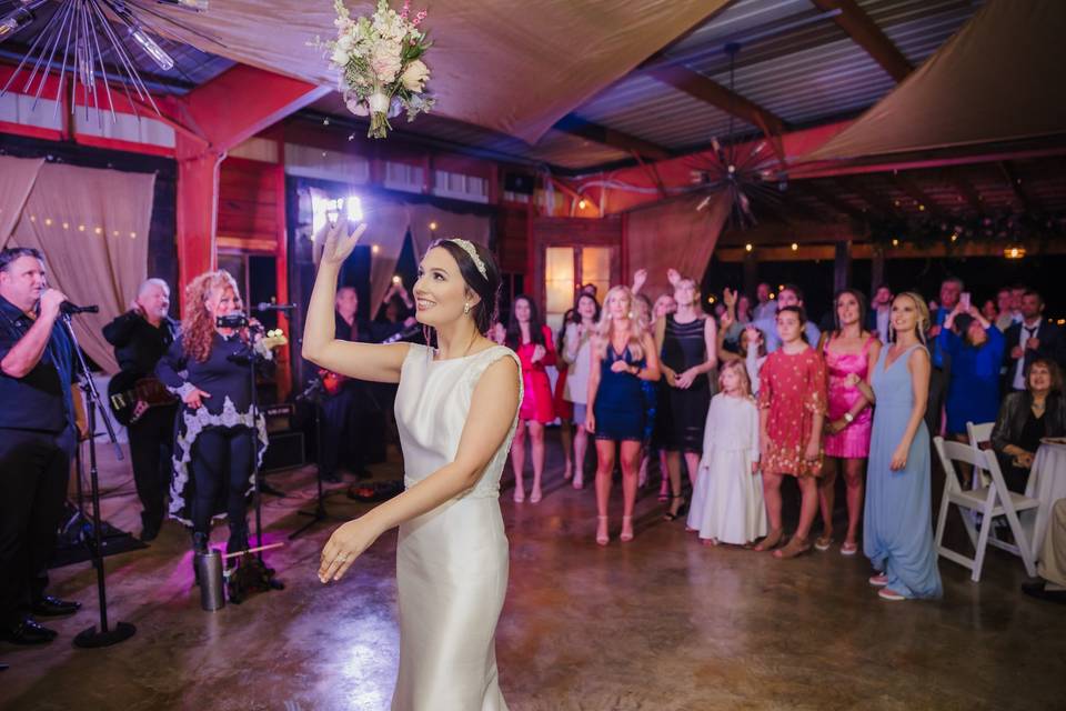 Bouquet toss in the pavilion