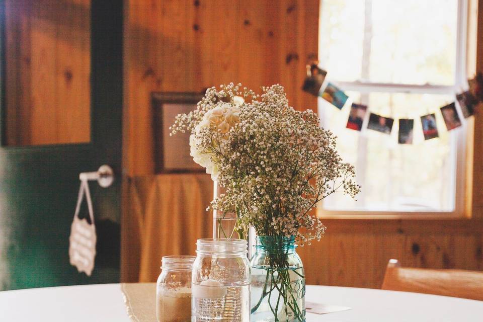 There are endless options when it comes to centerpieces! Show your personality and brighten the room with your ideas! Photo by Melissa Albey Photography