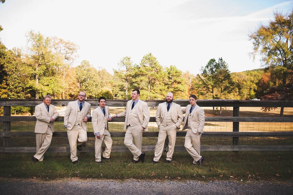 Some handsome fellas lined up against our fence that surrounds the property. Photo by Melissa Albey Photography