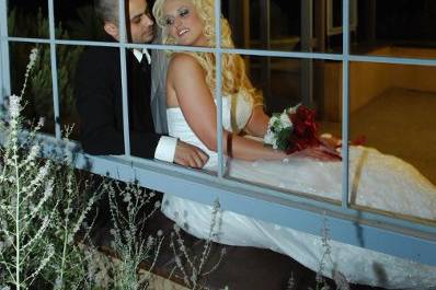Bride and groom by the window
