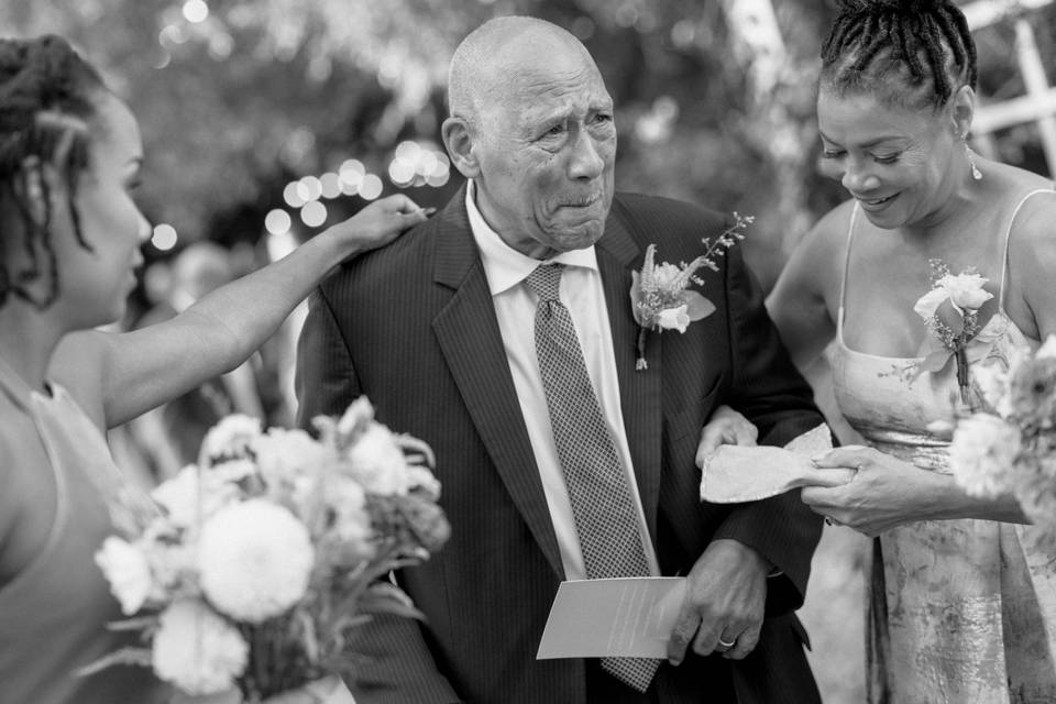 Grandfather of bride crying
