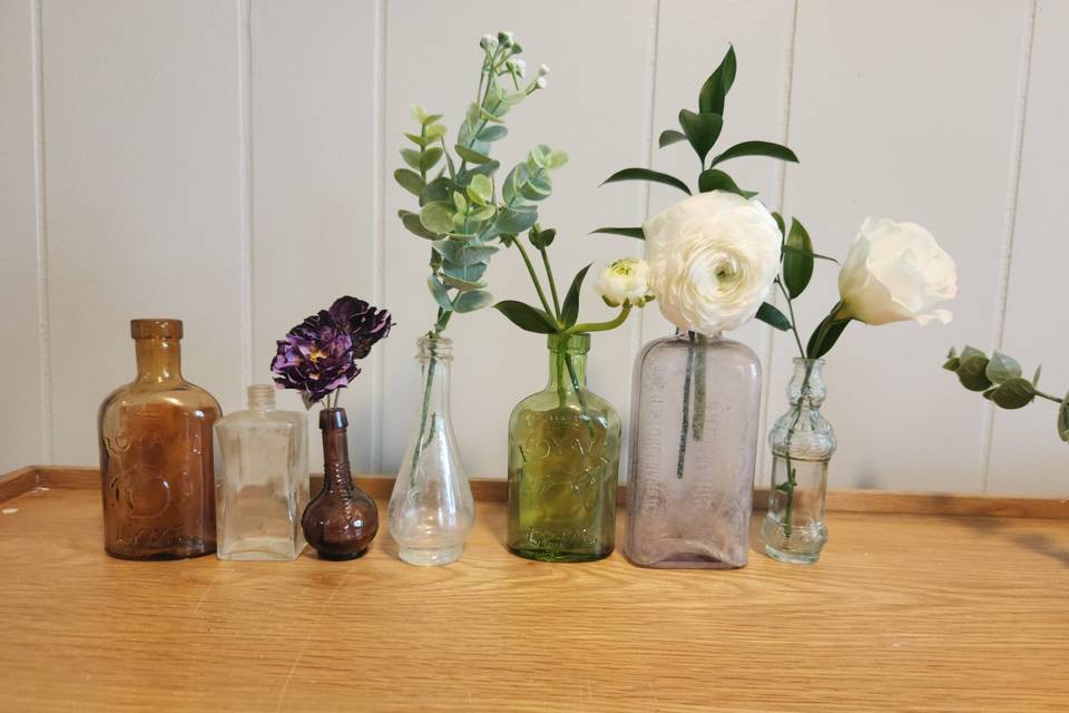 Bud vases in antique bottles