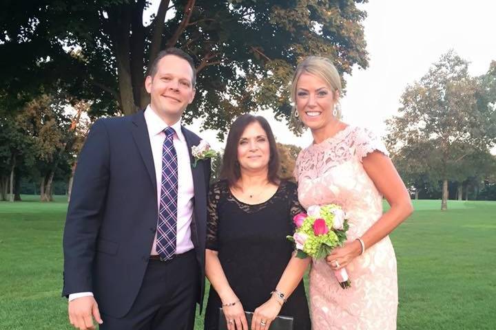 Newlyweds with the officiant