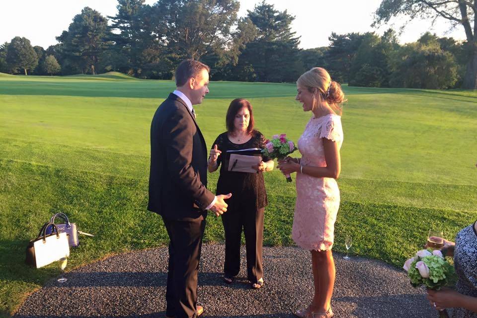 Newlyweds with the officiant