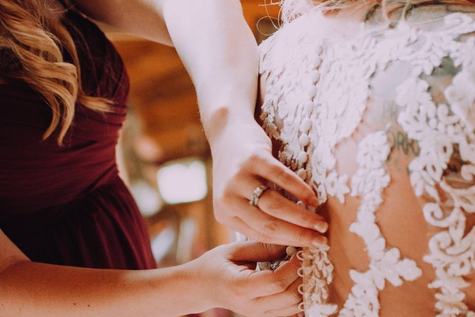 Buttoning the dress