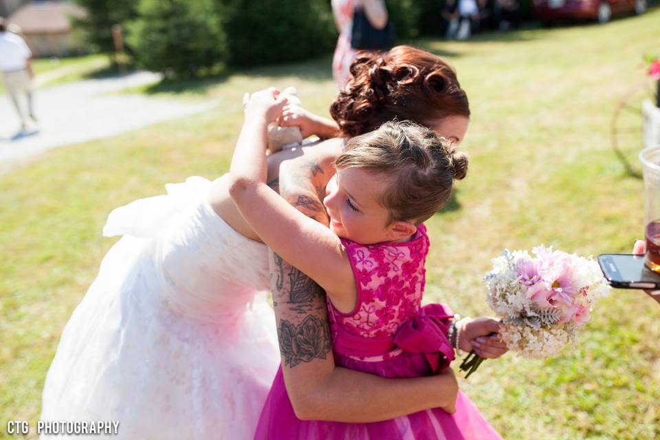 A hug from the flower girl