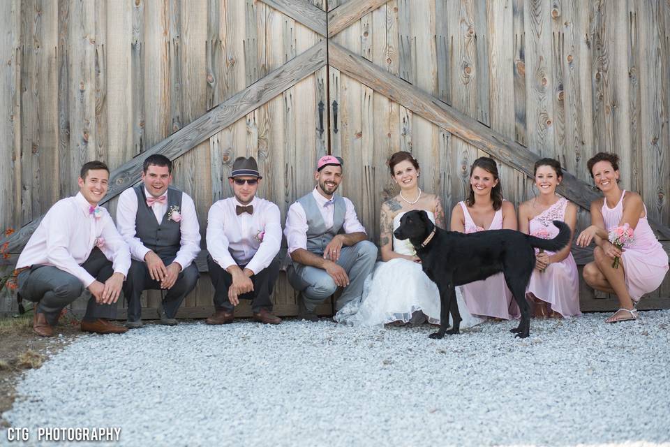 Bridal Party and Dog in front of the Historic Barn Doors