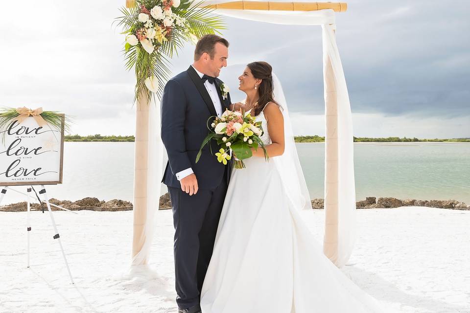 Beach wedding with arch