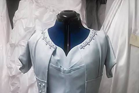 This was a redesign of grandmas wedding suit from the 40’s We made the dress bigger using the inside panels of the jacket. Then opened up the darts in the jacket , removed the collar and shortened the sleeves. We moved the zipper to the back and she wore it for her wedding reception.