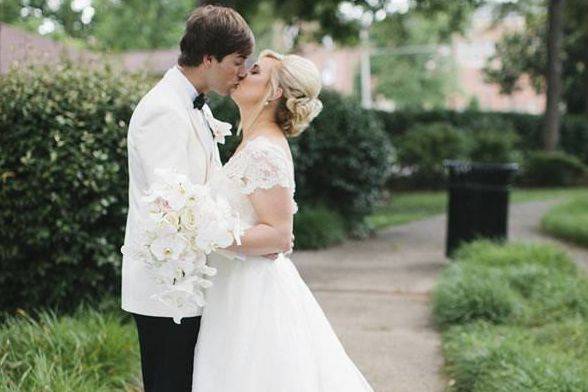 Couple kissing on sidewalk