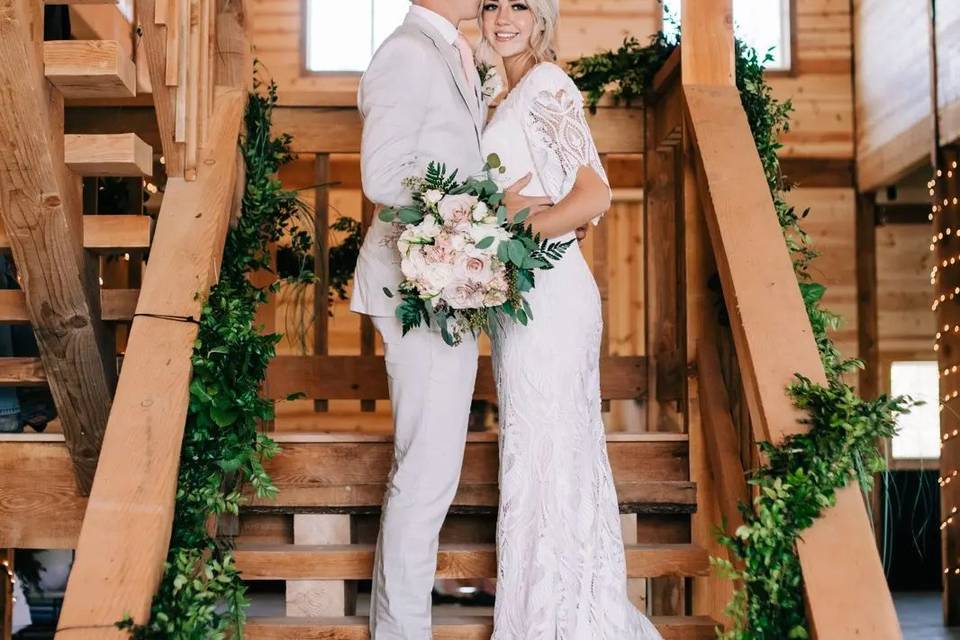 Newlyweds surrounded by rustic elegance
