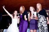 The bride with her bridesmaids singing