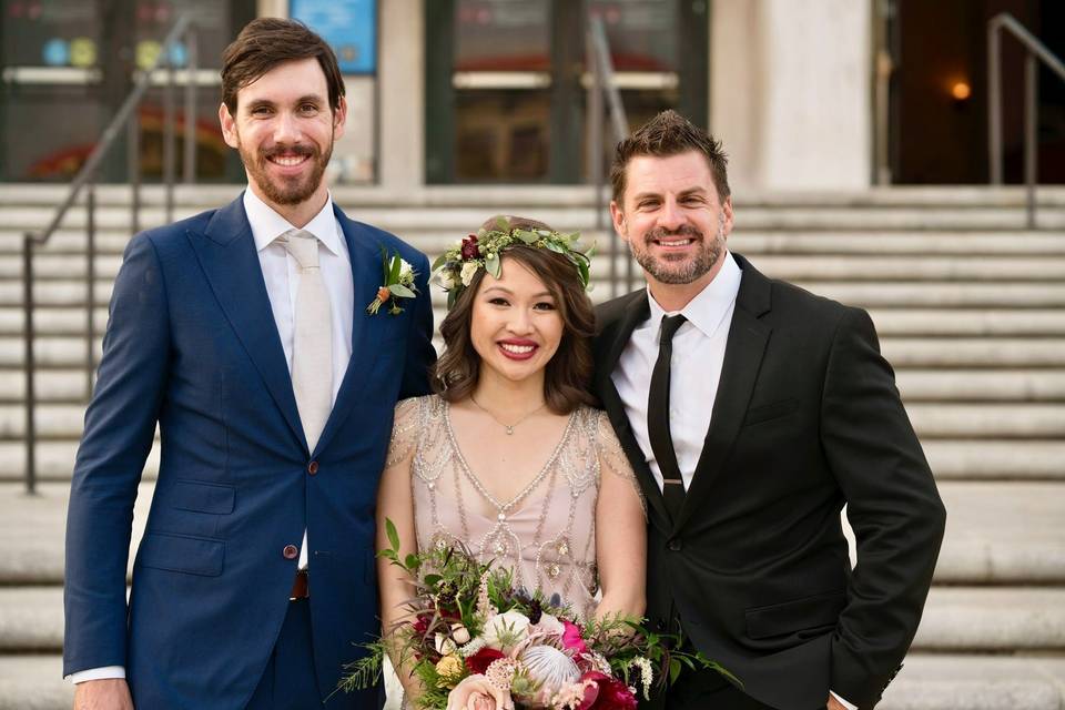 The newlyweds with the officiant