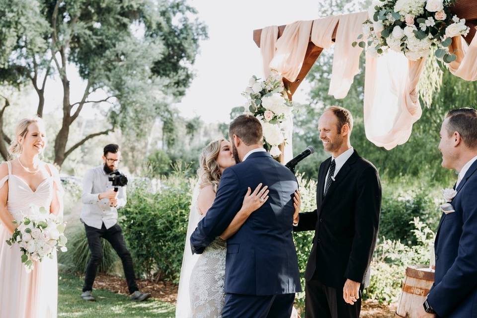 The officiant with the couple