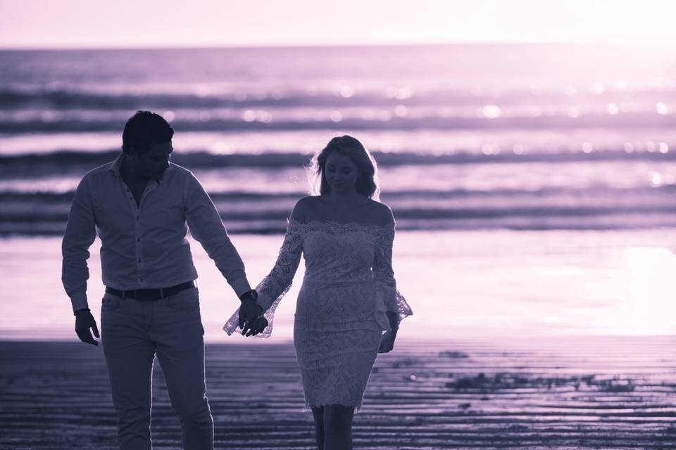 Couple Walking Down the Beach