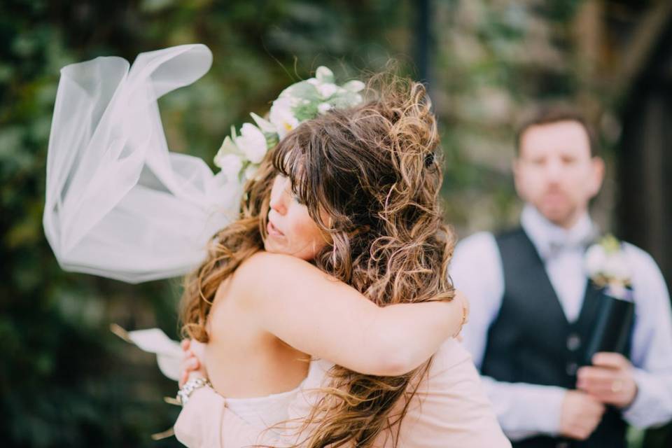 Bride hugging the officiant