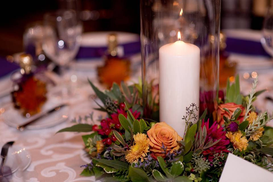 Candle and floral arrangement