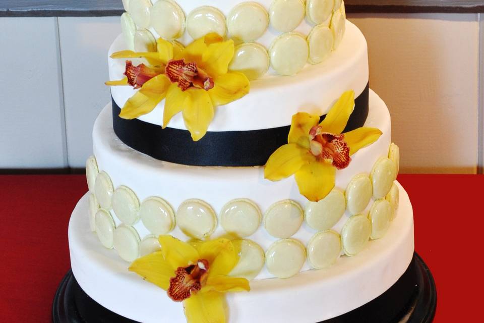 White and black ribbon cake with fresh Orchid flower and French Macarons from Art Of Cooking new Wedding cake and Dessert food station collection.For more information go to :http://www.aoclasvegas.com