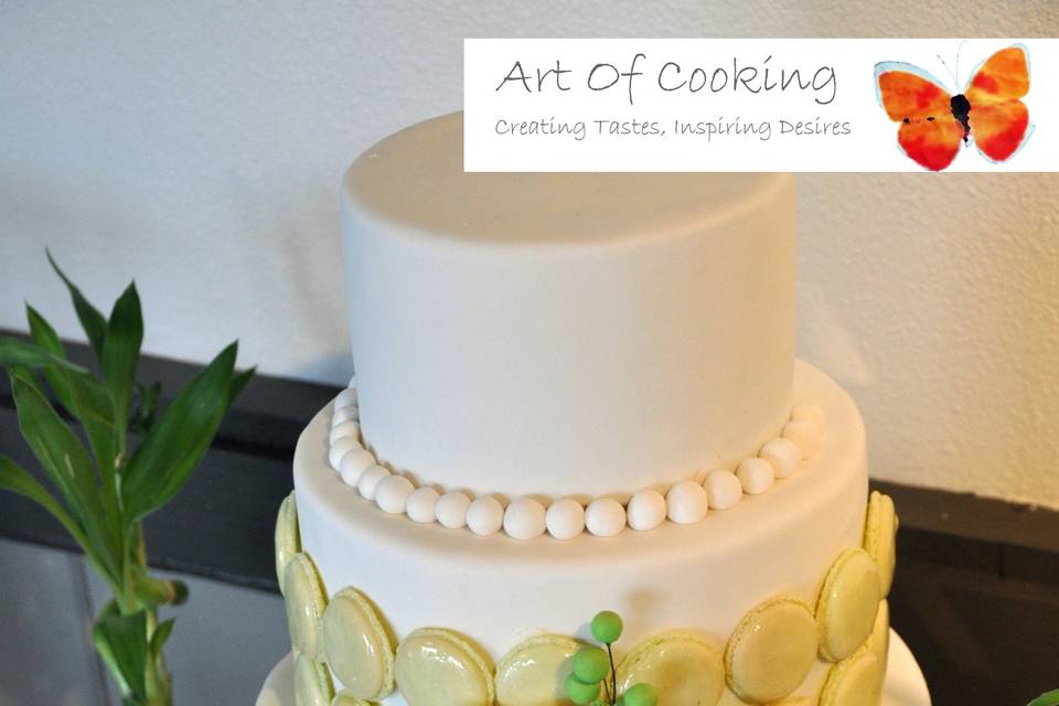 Elegant white Wedding cakes with pearls and French Macarons by Art Of Cooking new Wedding cake and Dessert food station collection.For more information go to :http://www.aoclasvegas.com