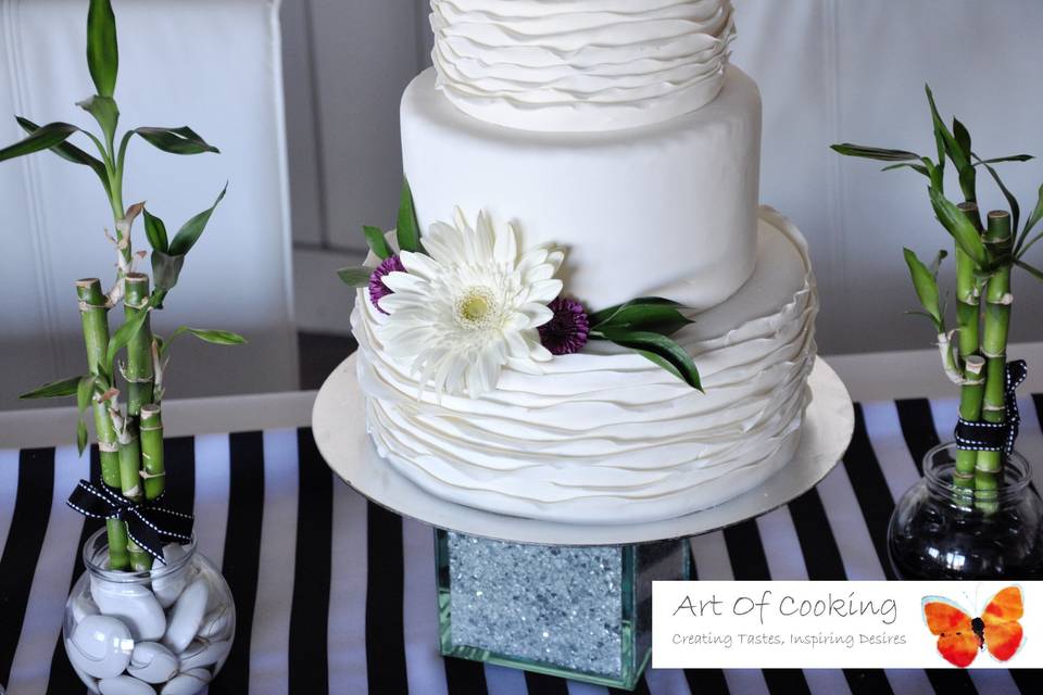 White Ruffle wedding cake with fresh Flowers by Art Of Cooking new Wedding cake and Dessert food station collection.For more information go to :http://www.aoclasvegas.com