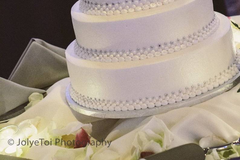 Larke-Adam wedding cake.  Silver Monogram cake topper.