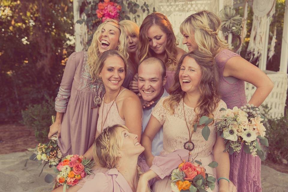 Bridal party posing with the groom in front of the gazebo with their bouquets. I along with Casey Schostag of Second Nature Creations (based out of San Francisco) created the bouquets, and came together to design and assemble the macrame backdrop and dream catchers for the gazebo along with the main floral arch-piece.