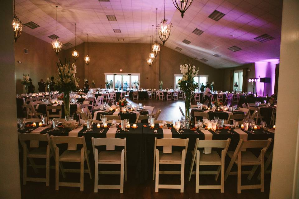 Reception hall with pink uplighting and decor