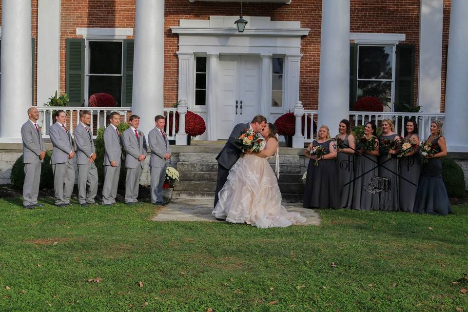 Newlyweds with the wedding attendants