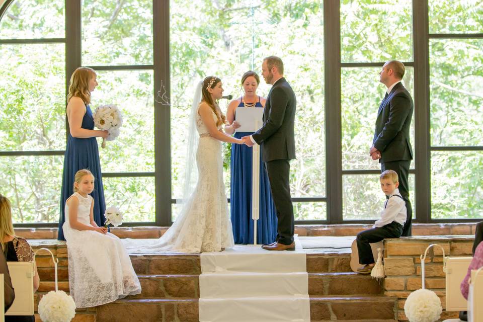 Ceremony at Stonegate Glass Chapel in Walnut Shade MO.