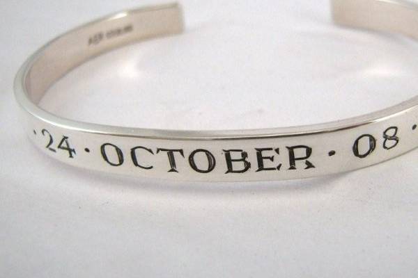 Have the date, name of your beloved, place of the wedding or even key words to your wedding dance song... engraved on a solid sterling or 14k Guardian Cuff.  Great gifts for the bride, groom and entire wedding party.