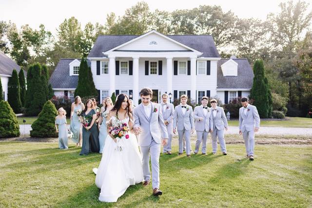 Wedding Party in Front of Hous