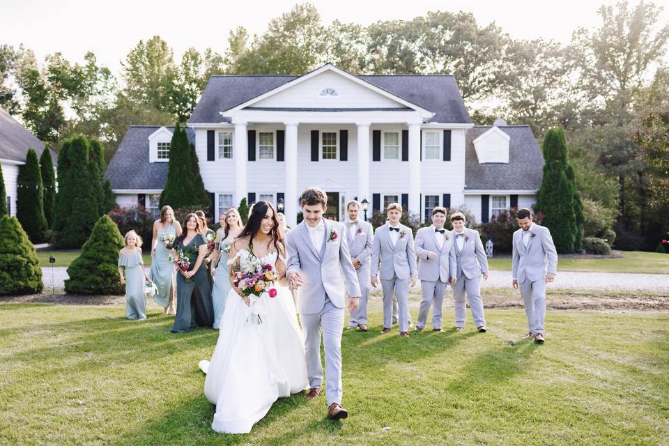 Wedding Party in Front of Hous