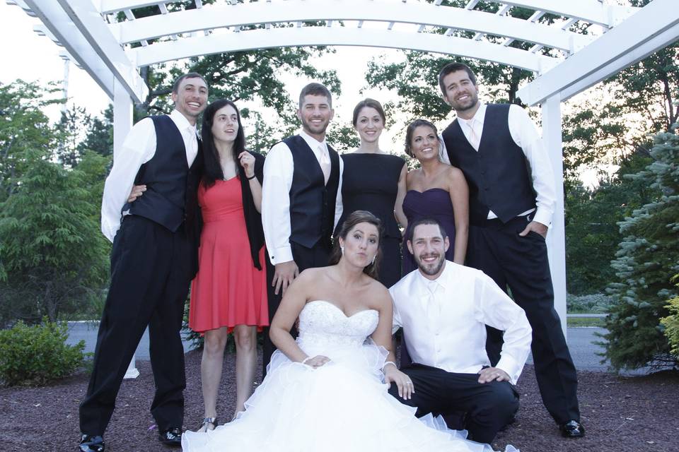 The couple with the wedding attendants