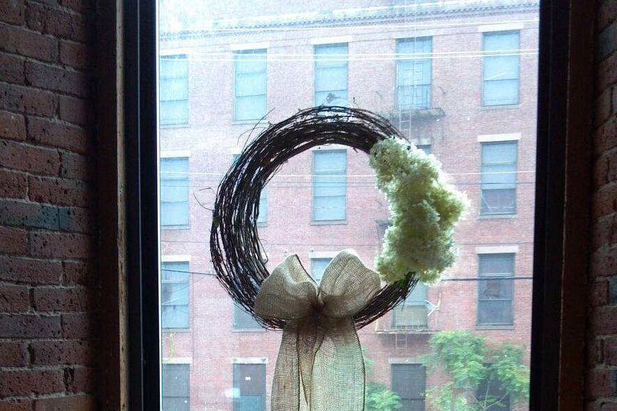 Grapevine wreathes with fresh Hydrangea with burlap bow accent by Lady Slipper Affairs & Events.