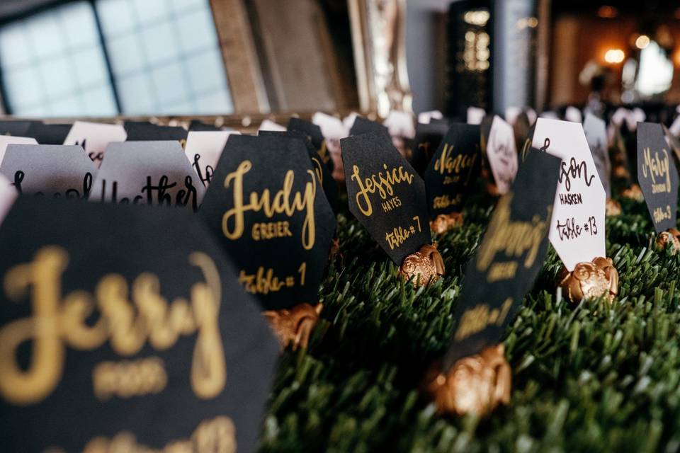 Place cards with black, gold, and white