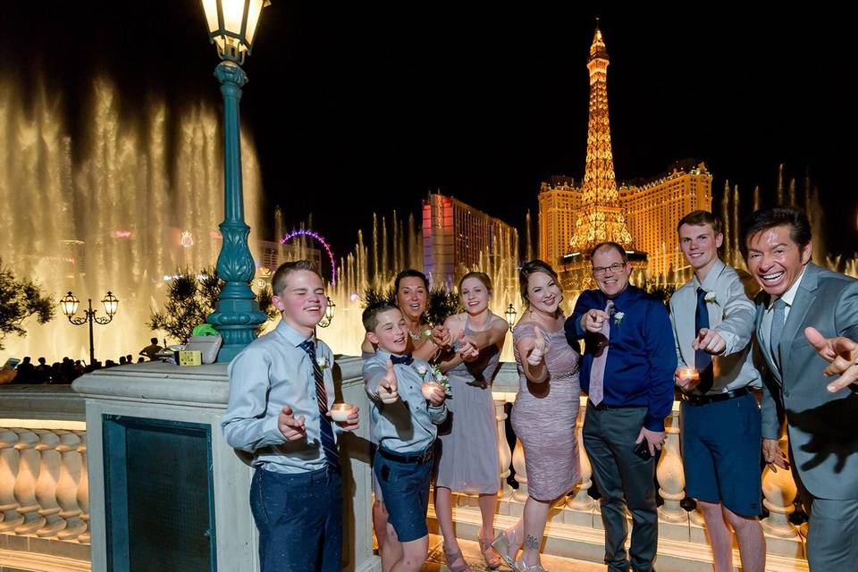 Newlyweds and their guests with the officiant