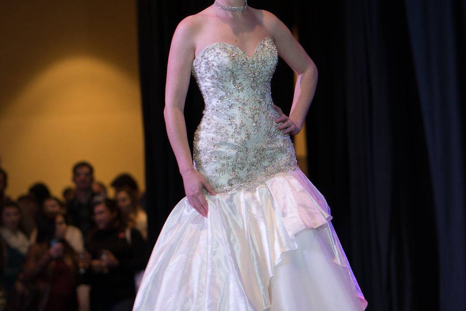 On the runway, Uptown Bride shows off it's styles of wedding gowns
