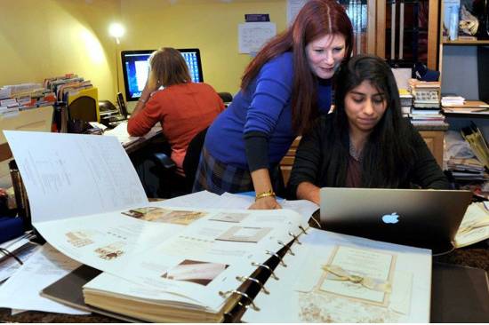 Denise Buzy-Pucheu and her office/design staff reviewing orders in studio - photo courtesy of Carol Kaliff