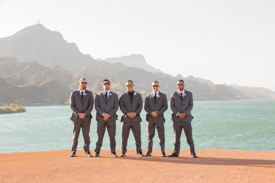 Handsome groomsmen standing on the upper portion of The Pointe