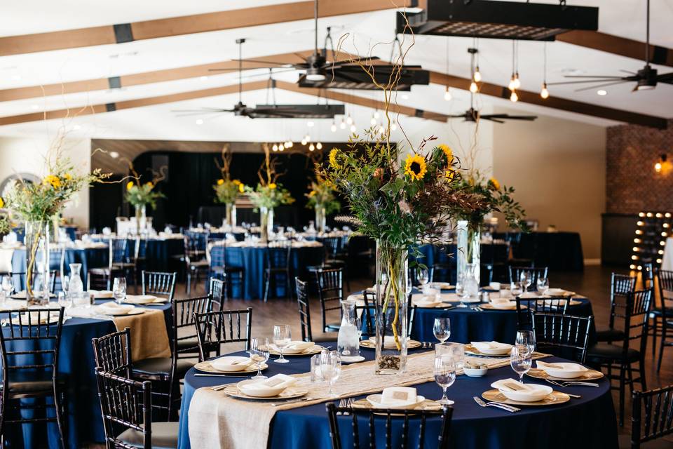 Gorgeous sunflower centerpieces by Interior Gardens *florals unique* (Photo by: Melissa Wright Photography)