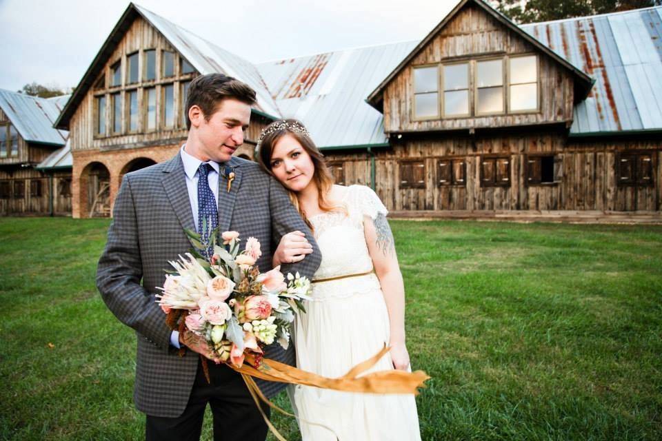 Bride leaning on her groom