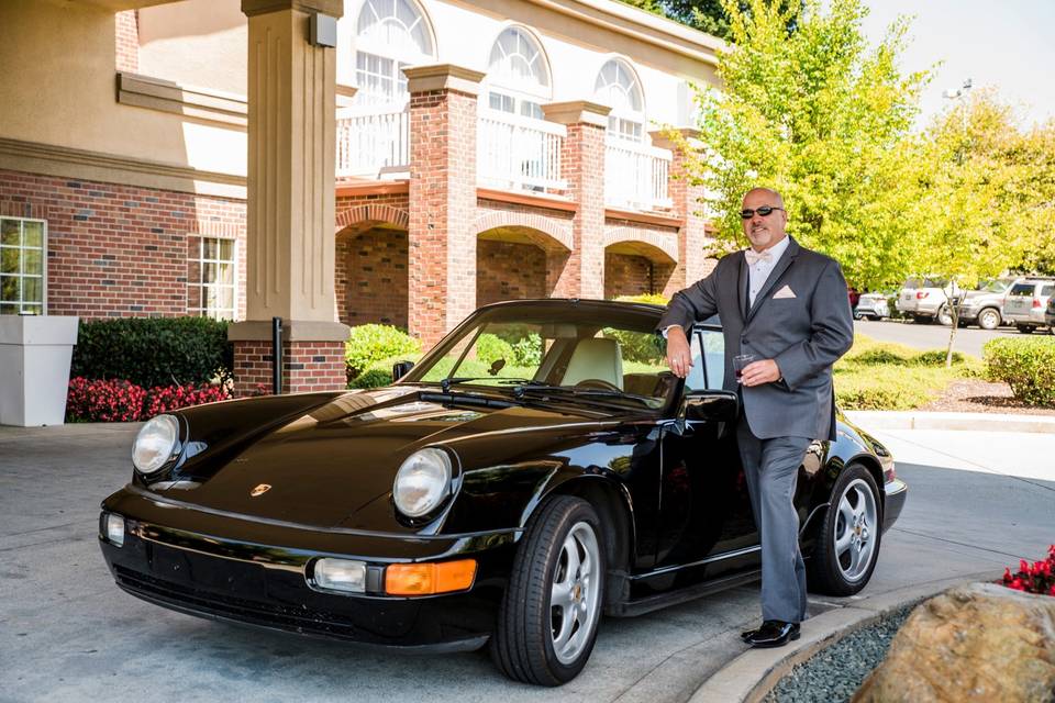 Groom with classic Porsche.