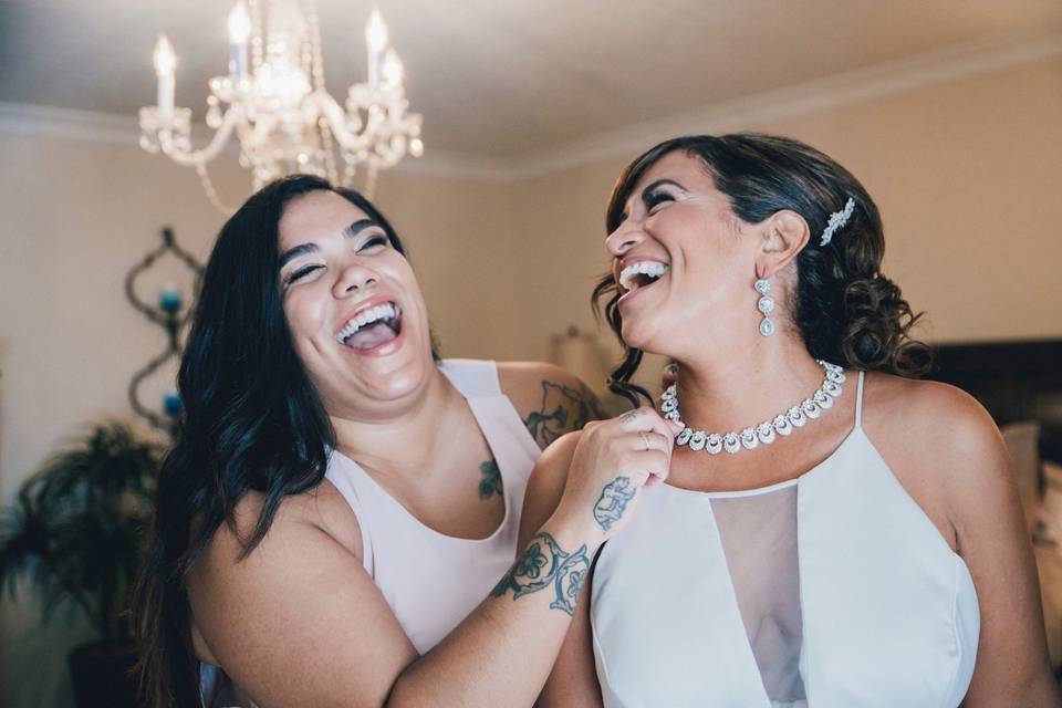 Bride with bridesmaid.