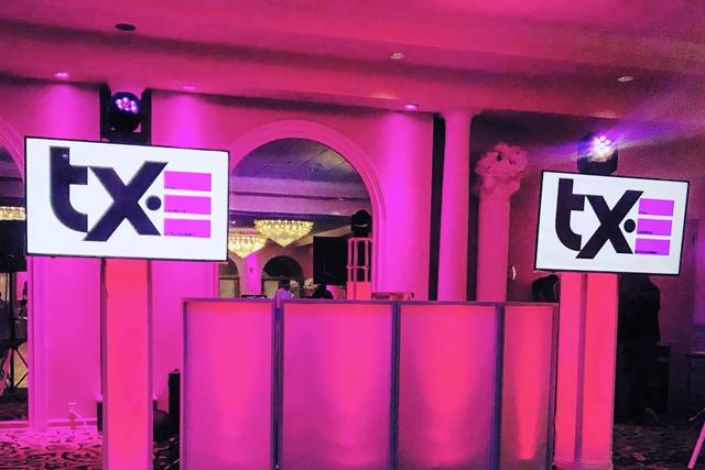 Illuminated DJ Booth with TVs